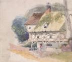 A Half-Timbered Thatched Cottage with a Man at the Door